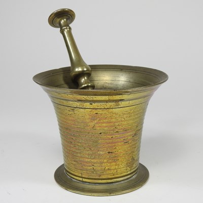 Lot 645 - A brass pestle and mortar