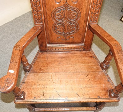 Lot 57 - A carved oak wainscot chair
