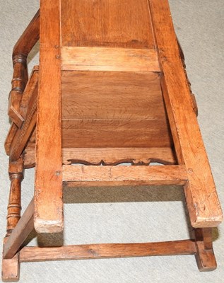 Lot 57 - A carved oak wainscot chair