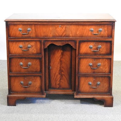 Lot 542 - A Georgian style mahogany kneehole desk