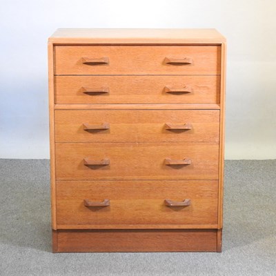 Lot 570 - A mid 20th century oak chest of drawers