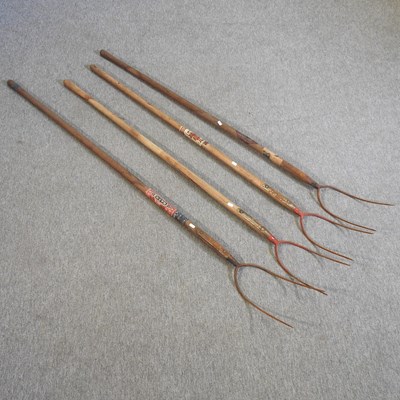 Lot 331 - A collection of four pitch forks