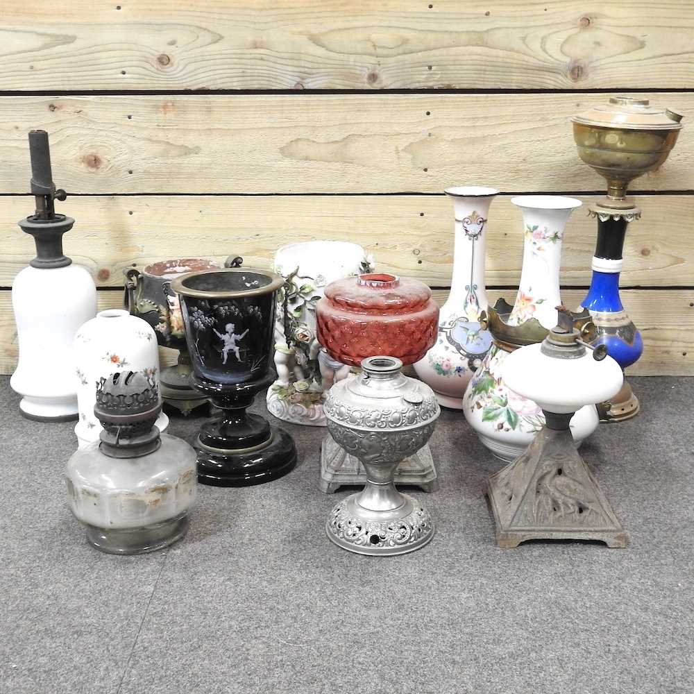 Lot 173 - A collection of oil lamp bases