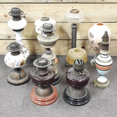 Lot 117 - A collection of oil lamp bases