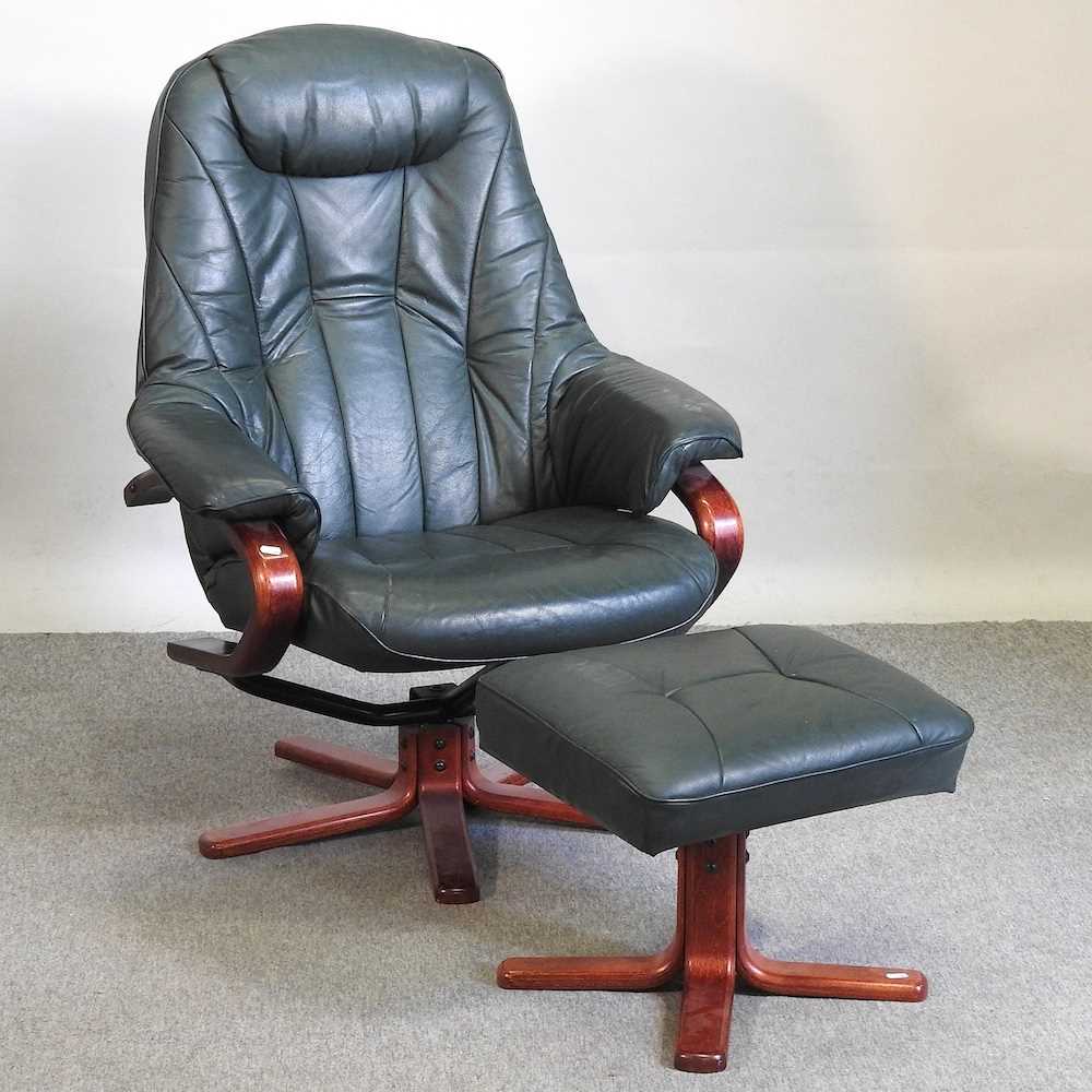 Lot 448 A green leather upholstered swivel chair