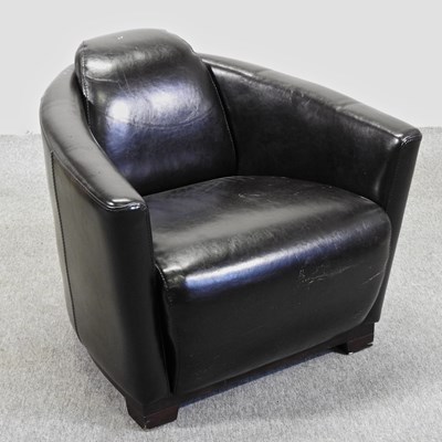 Lot 695 - A contemporary black leather upholstered aviator style armchair