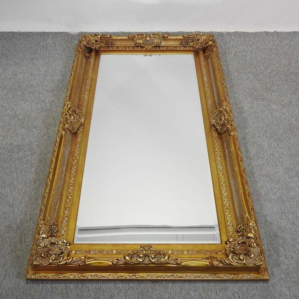 Lot 58 - A large modern gilt framed wall mirror
