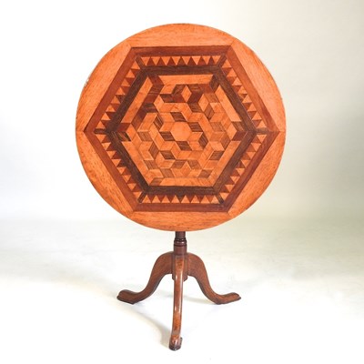 Lot 126 - A parquetry tripod table