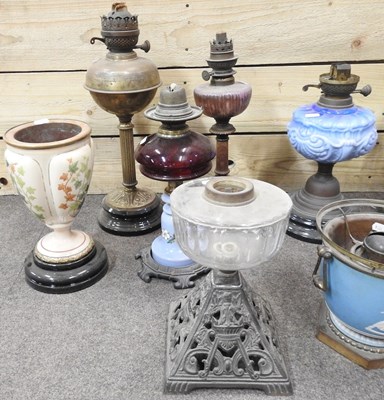 Lot 647 - A collection of ten oil lamps