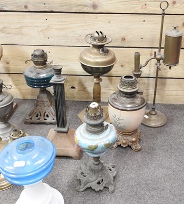 Lot 440 - A collection of ten oil lamp bases