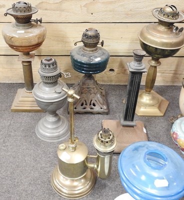 Lot 440 - A collection of ten oil lamp bases