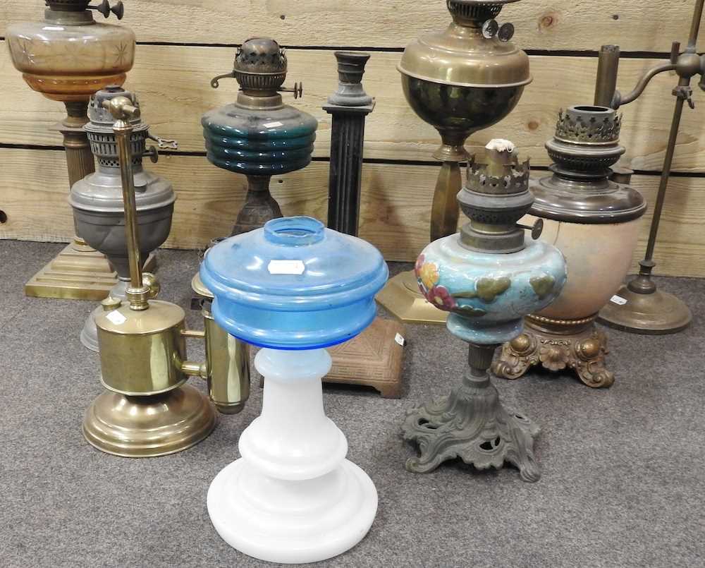 Lot 440 A collection of ten oil lamp bases
