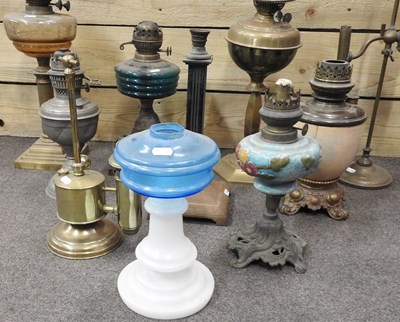 Lot 440 - A collection of ten oil lamp bases