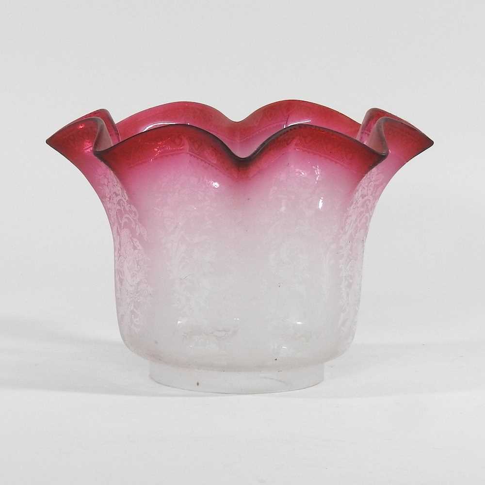 Lot 319 - A clear and pink etched glass oil lamp shade