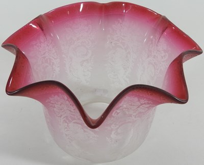 Lot 319 - A clear and pink etched glass oil lamp shade