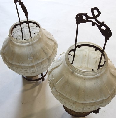 Lot 696 - A pair of hanging brass oil lamps