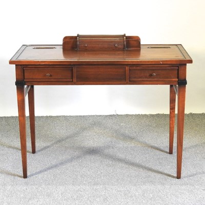 Lot 568 - A fruitwood writing table