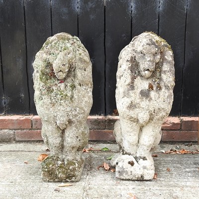 Lot 419 - A pair of cast stone lions