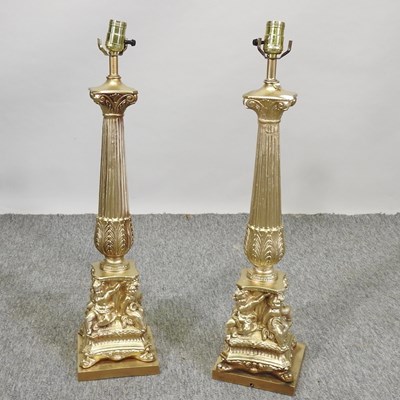 Lot 509 - A pair of large gilt painted table lamps