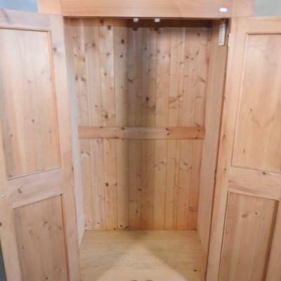 Lot 553 - A pine wardrobe