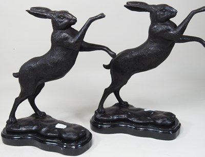 Lot 106 - A pair of bronze models of boxing hares