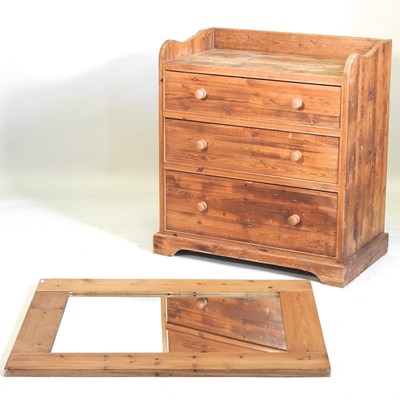 Lot 442 - A pine chest of drawers and a mirror