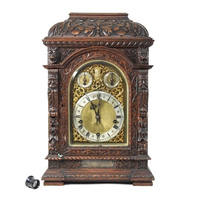 Lot 74 - An Edwardian oak bracket clock