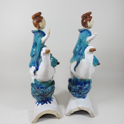 Lot 24 - A pair of glazed roof tiiles