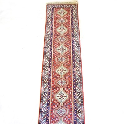 Lot 549 - A Persian runner