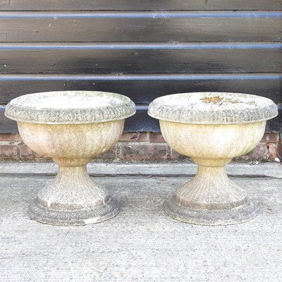 Lot 614 - A pair of garden urns