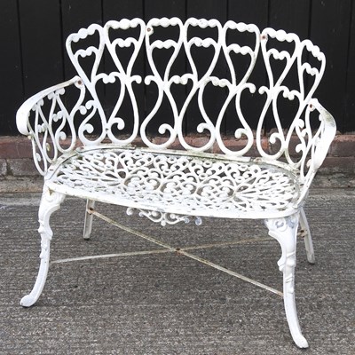 Lot 497 - A white garden bench