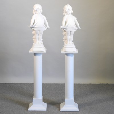 Lot 446 - A pair of figures on pedestals