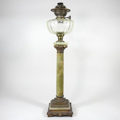 Lot 435 - An onyx oil lamp