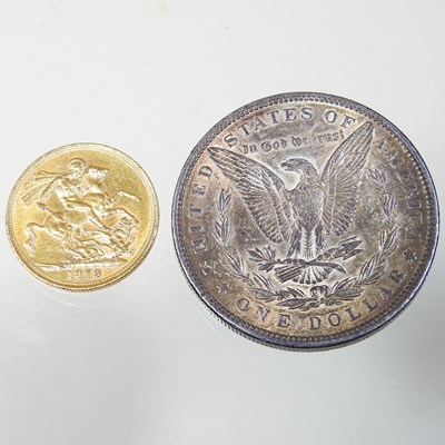 Lot 12 - A sovereign and a dollar coin