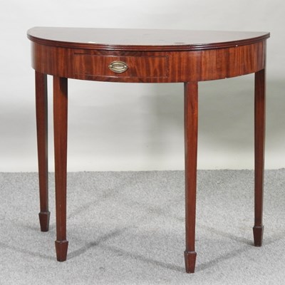 Lot 325 - A George III style mahogany half round side table