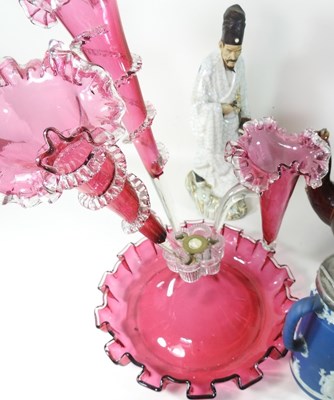 Lot 144 - A 19th century cranberry glass part epergne