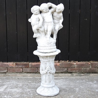 Lot 423 - A cast stone figure group