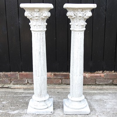 Lot 511 - A pair of cast stone columns