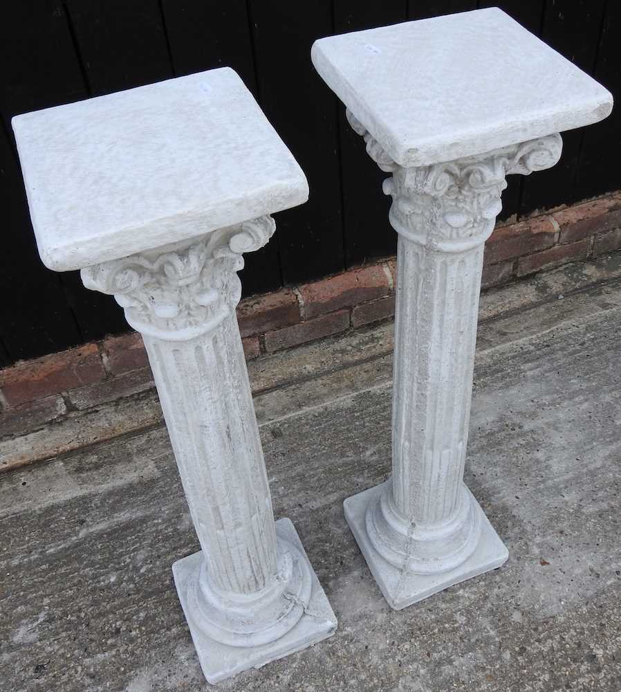 Lot 511 - A pair of cast stone columns
