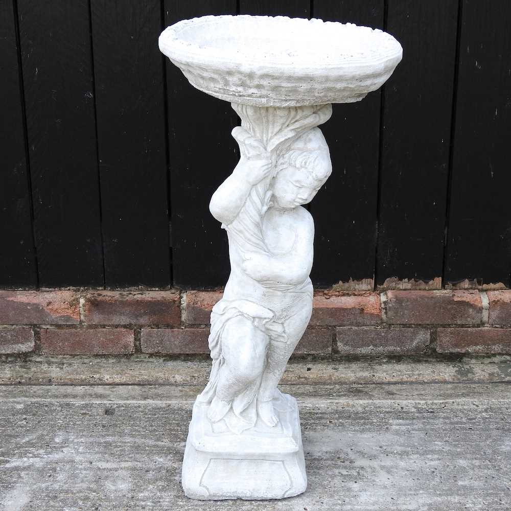 Lot 494 - A cast stone bird bath