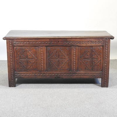 Lot 335 - A carved oak coffer