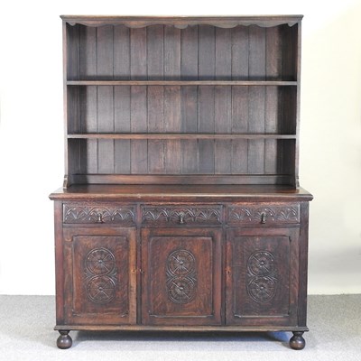 Lot 341 - A carved oak dresser