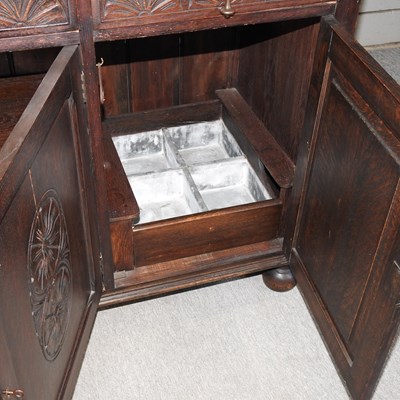 Lot 341 - A carved oak dresser