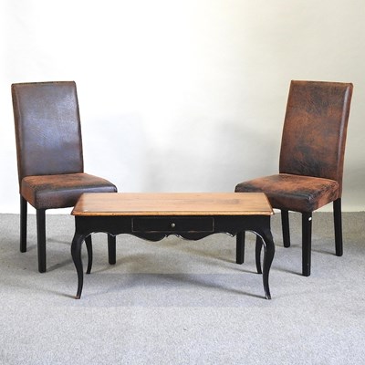 Lot 516 - A coffee table and two chairs