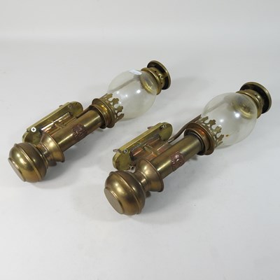 Lot 101 - A pair of early 20th century brass ships wall lamps