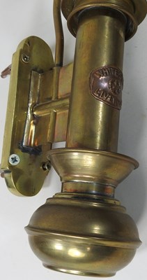 Lot 101 - A pair of early 20th century brass ships wall lamps