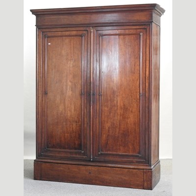 Lot 505 - A 19th century continental fruitwood linen press