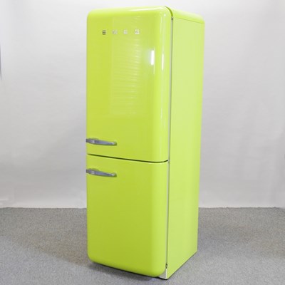 Lot 402 - A SMEG lime green fridge-freezer