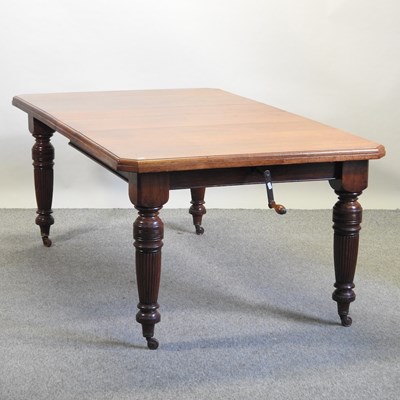 Lot 506 - A late Victorian walnut wind out extending dining table