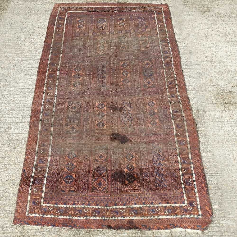 Lot 439 A large oriental rug